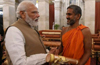 Pejawar Seer meets PM Modi; submits memorandum seeking due recognition to Tulu